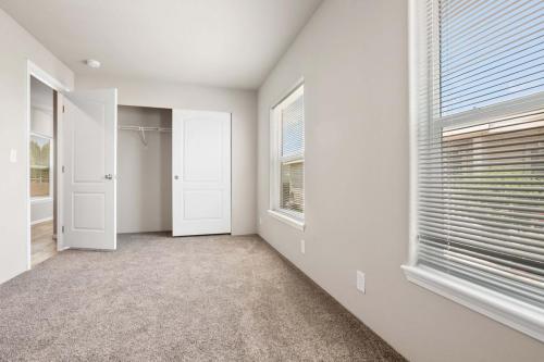 A room with white walls and carpet.