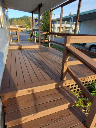 A wooden deck with railings.